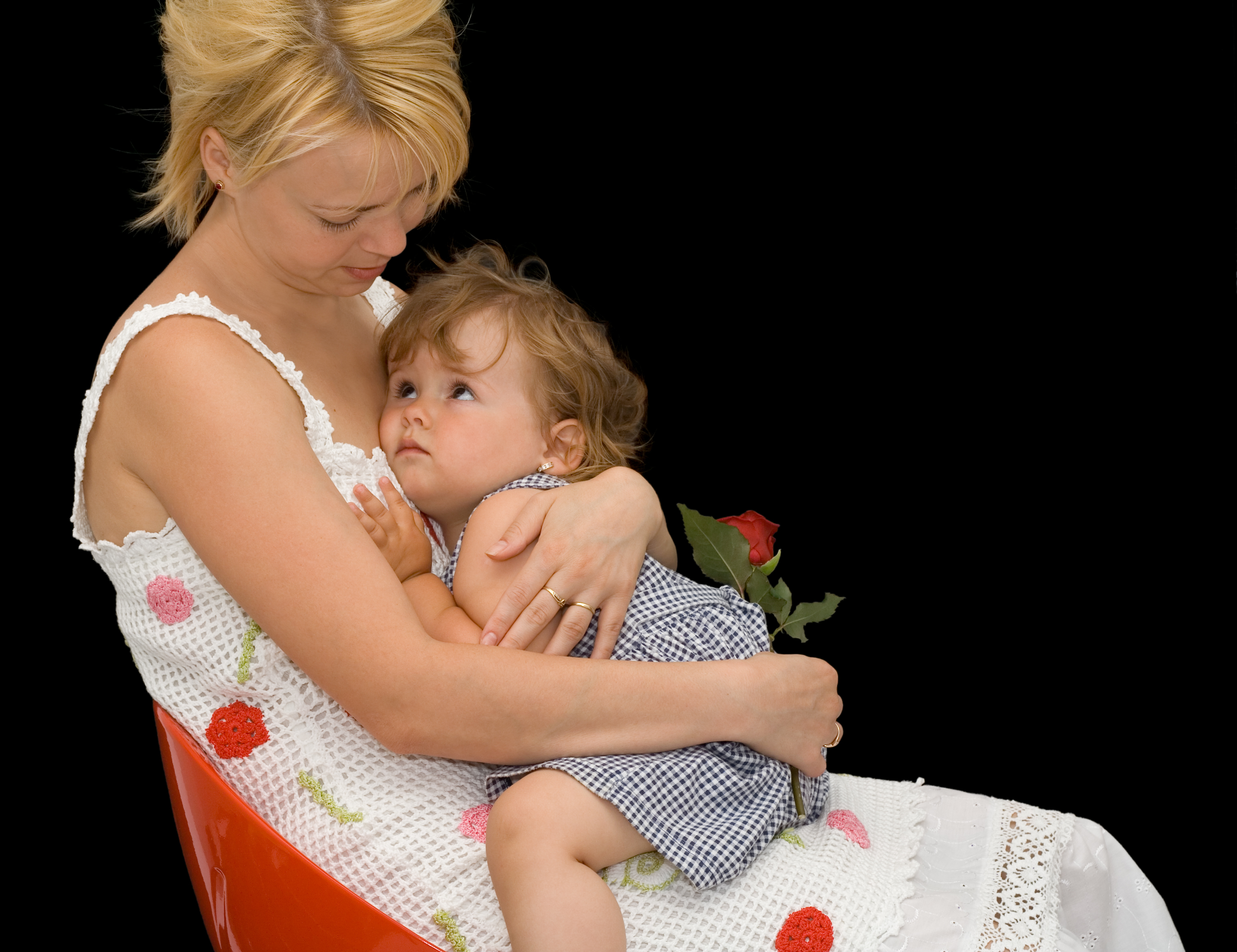 mom holding her baby on her lap.