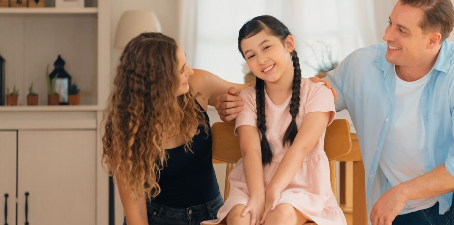 child at counseling with her parents