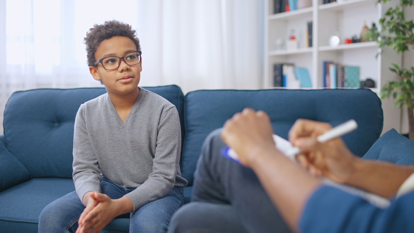 young boy with a male therapist